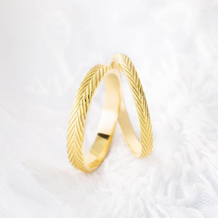 Conjunto de alianzas de boda de oro amarillo modelo espigas