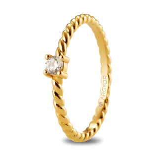 Anillo oro amarillo 18k trenzado con circonio redondo